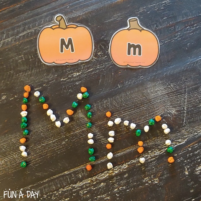 pumpkin letter M cards with letter m made out of dyed chickpeas