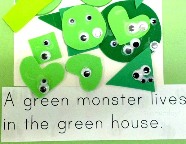 child made halloween book page with text that reads a green monster lives in the green house