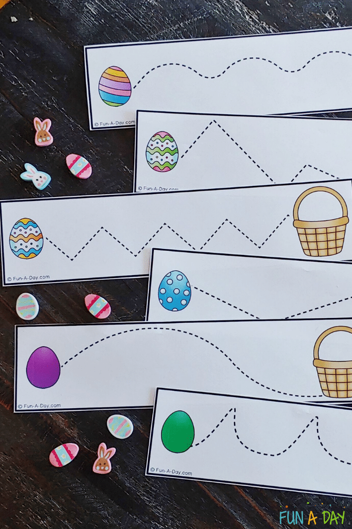 free printable easter fine motor and cutting strips pictured with mini erasers