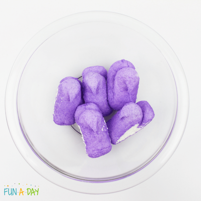 purple peeps without candy eyes in a clear glass bowl