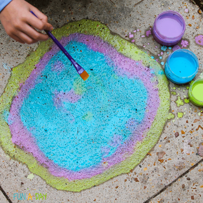child painting on a sidewalk