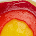 layers of gold, red, orange, and yellow slimes with text that reads lava slime science and sensory fun