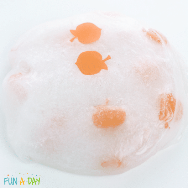 clear slime with pumpkin glitter throughout