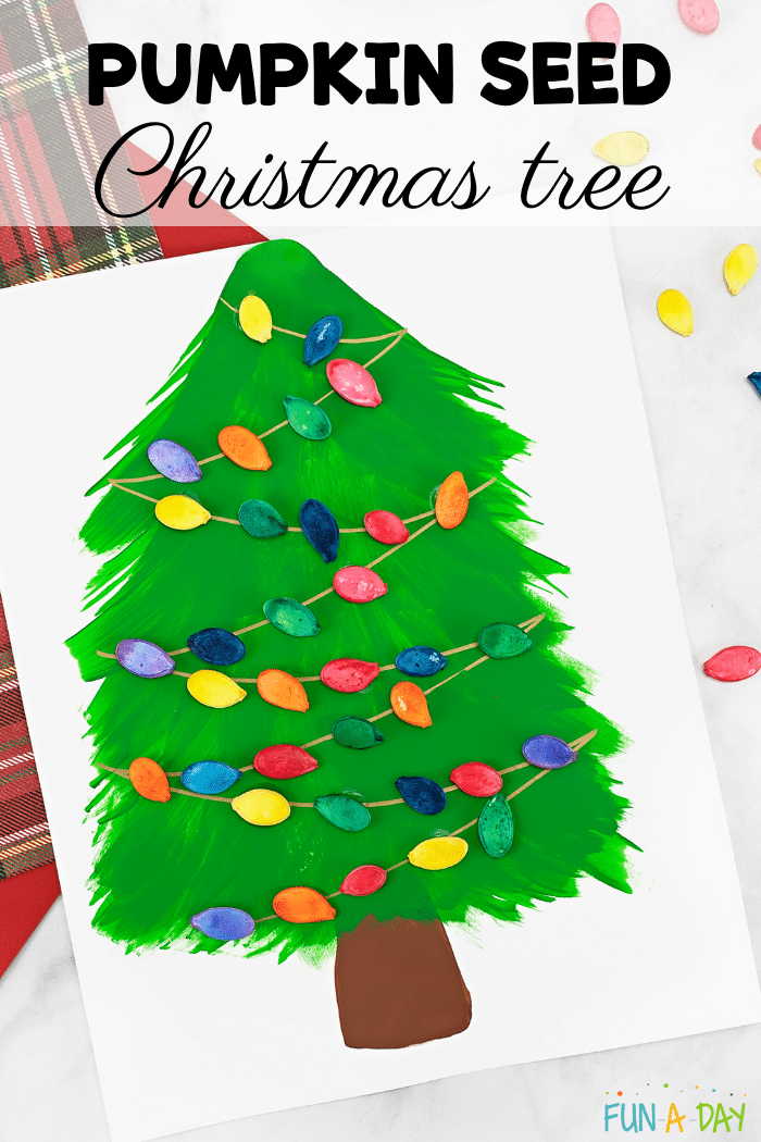 christmas tree art decorated with dyed pumpkin seeds with text that reads pumpkin seed christmas tree