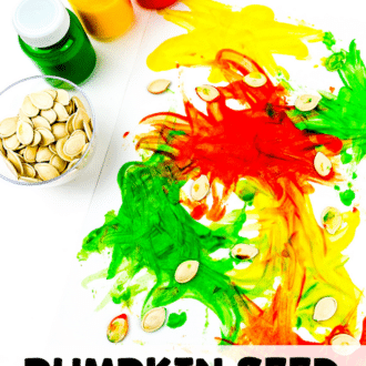 Green, yellow, and red paint bottles, a small bowl of pumpkin seeds, and pumpkin seed art in progress.
