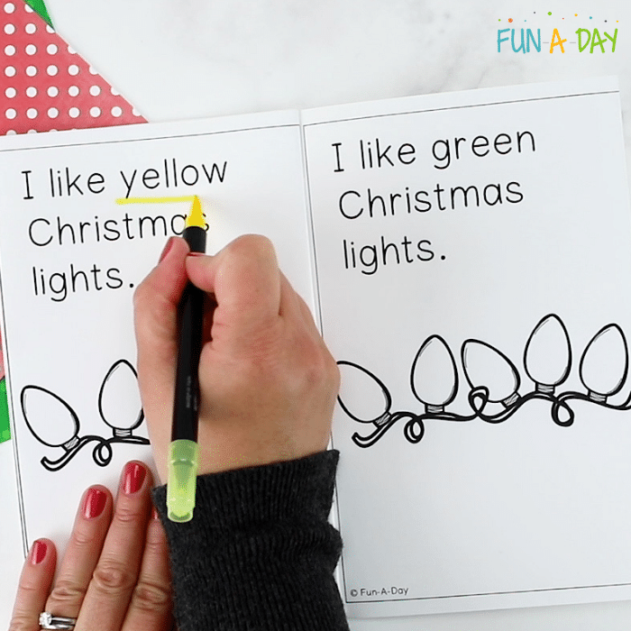 Yellow marker underlining the word yellow in the Christmas lights printable book.