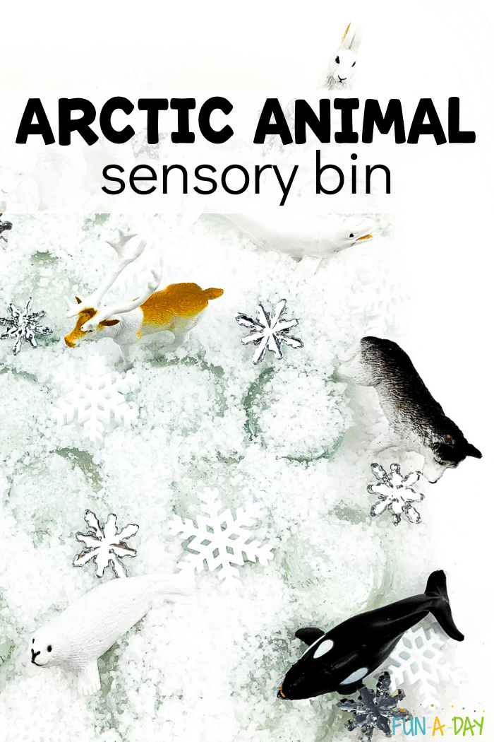 Instant snow, snowflake confetti, and arctic animals in a bin. Text that reads arctic animal sensory bin.