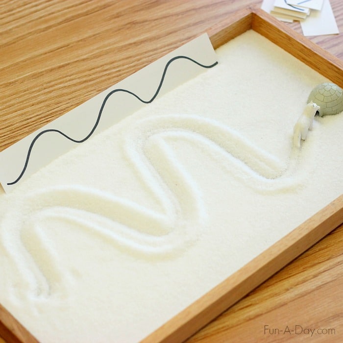 salt tray with wavy line writing prompt and arctic animal