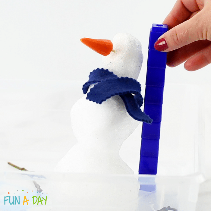Measuring a small snowman snowman with unifix cubes.