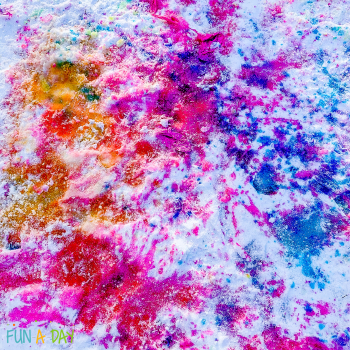 Pink, blue, and orange snow painting