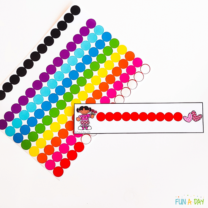 Page of rainbow dots stickers with a valentine tracing printable