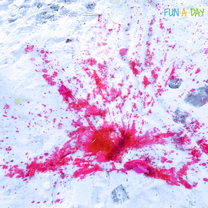 Splat of pink paint in the snow