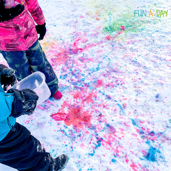 Children viewing their snow painting