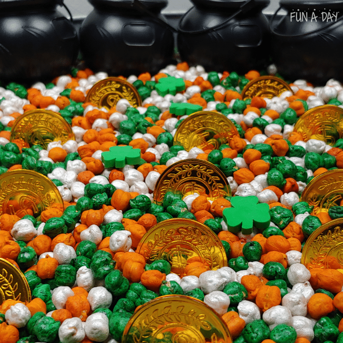 St. Patrick's Day sensory play with dyed chickpeas