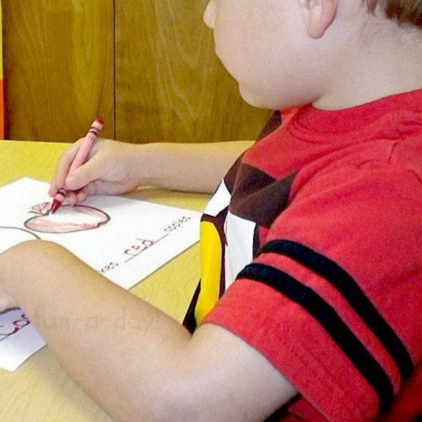 Preschooler coloring in page of apple class book