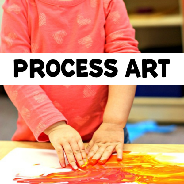 preschooler with hands in paint and text that reads process art