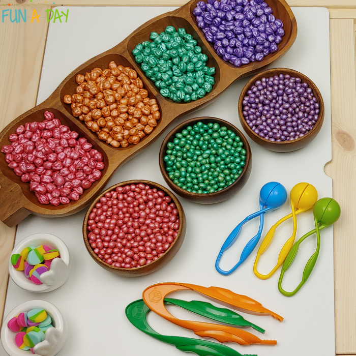 Colorful chickpeas and soybeans, egg mini erasers, and preschool fine motor tools