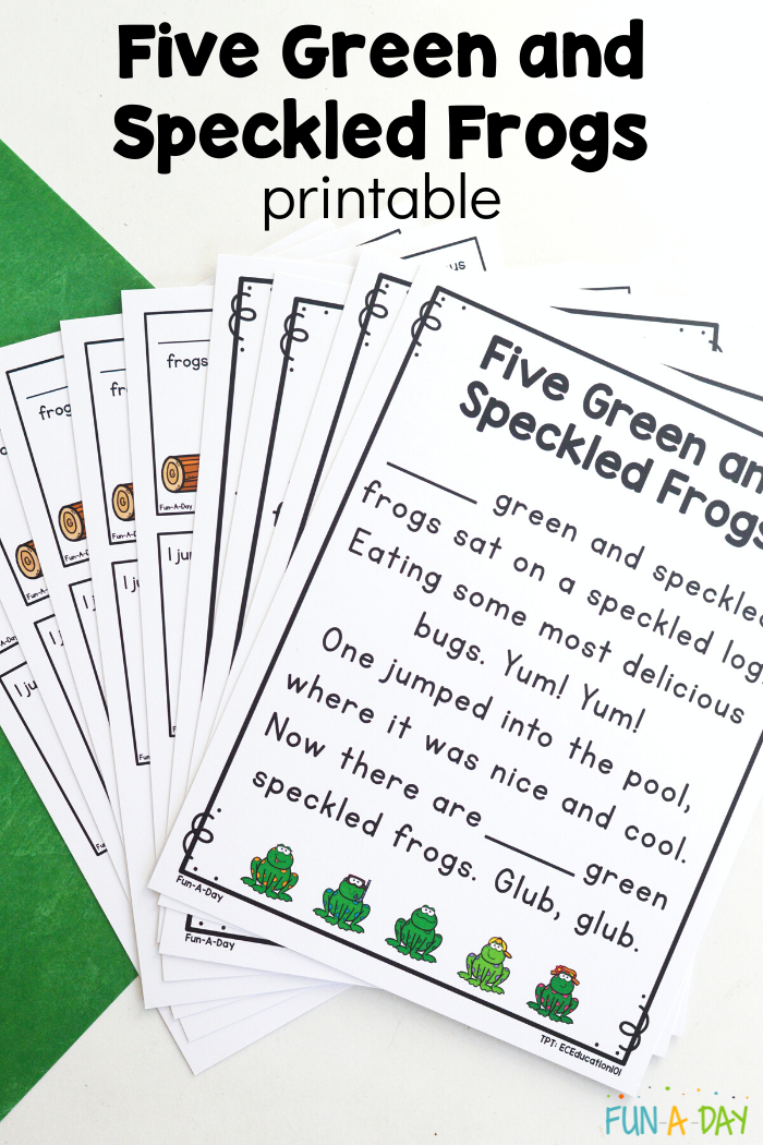 five green and speckled frogs printables fanned out on tabletop
