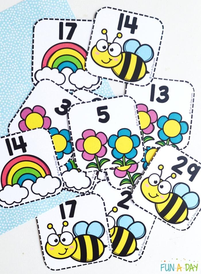 spring calendar number printables for preschoolers - rainbows, bees, and flowers with numbers for math practice