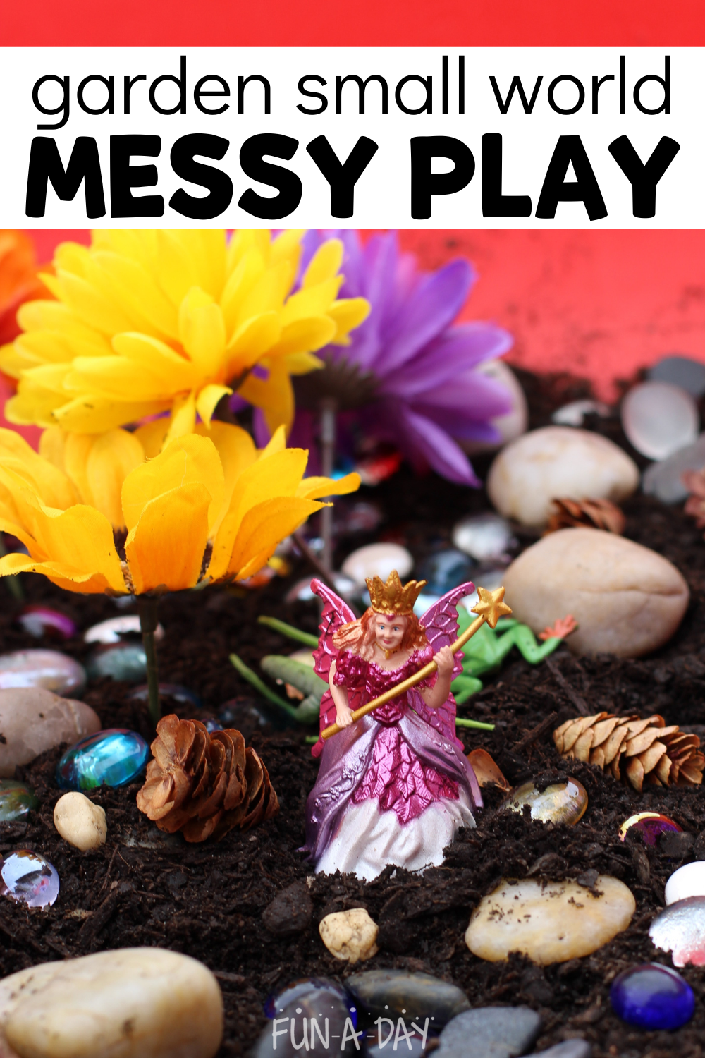 Fairy toy in dirt, surrounded by rocks, fake flowers, pine cones, and glass gems. Text reads garden small world messy play.