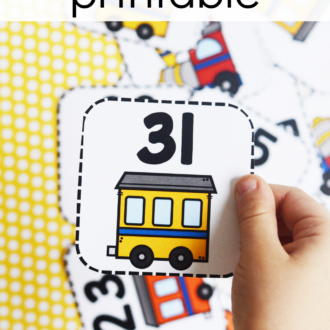child holding up number 31 card with text that reads number train printable