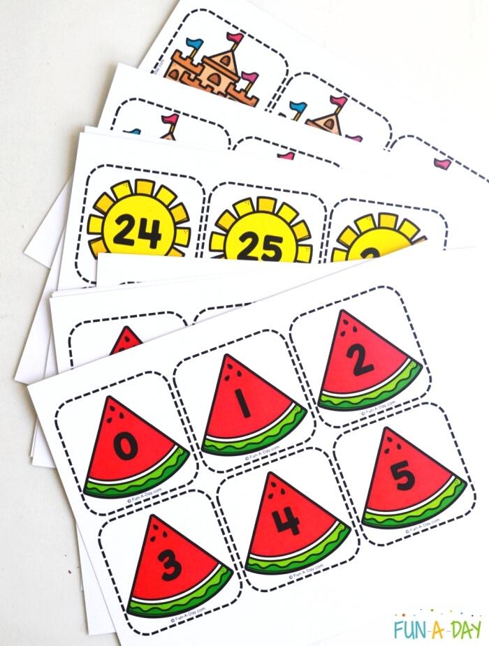 printed out stack of number cards for preschool math practice - summer themes