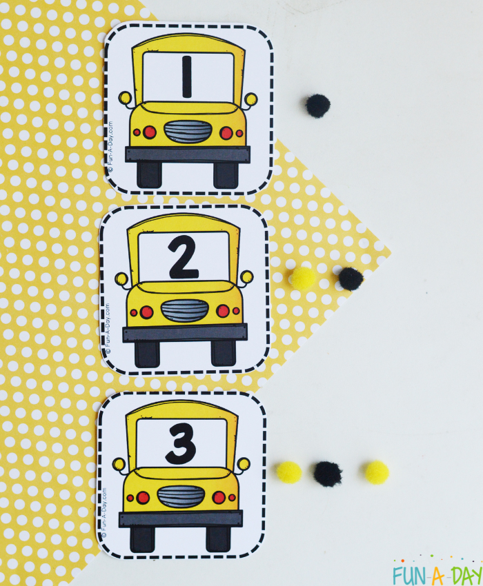 bus calendar numbers 1, 2, and 3 with corresponding number of pompoms next to each