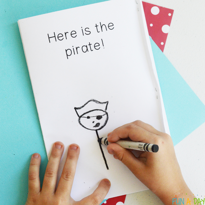 preschooler drawing a pirate in pirate printable book