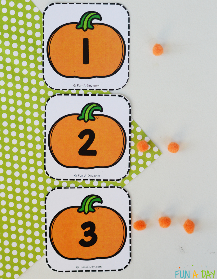 pumpkin numbers 1, 2, 3 with orange pompoms