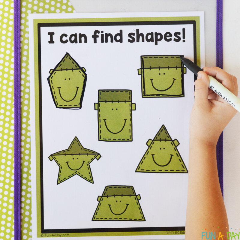 preschooler tracing over monster shapes printable
