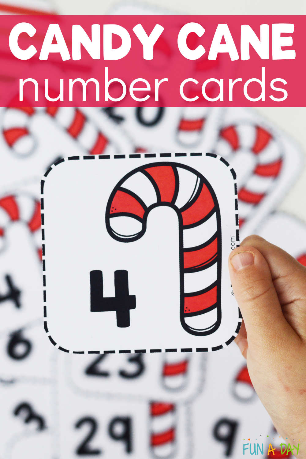 Child holding calendar number 4 with text that reads candy cane number cards