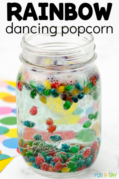 Colored corn kernels moving in a jar with text that reads rainbow dancing popcorn