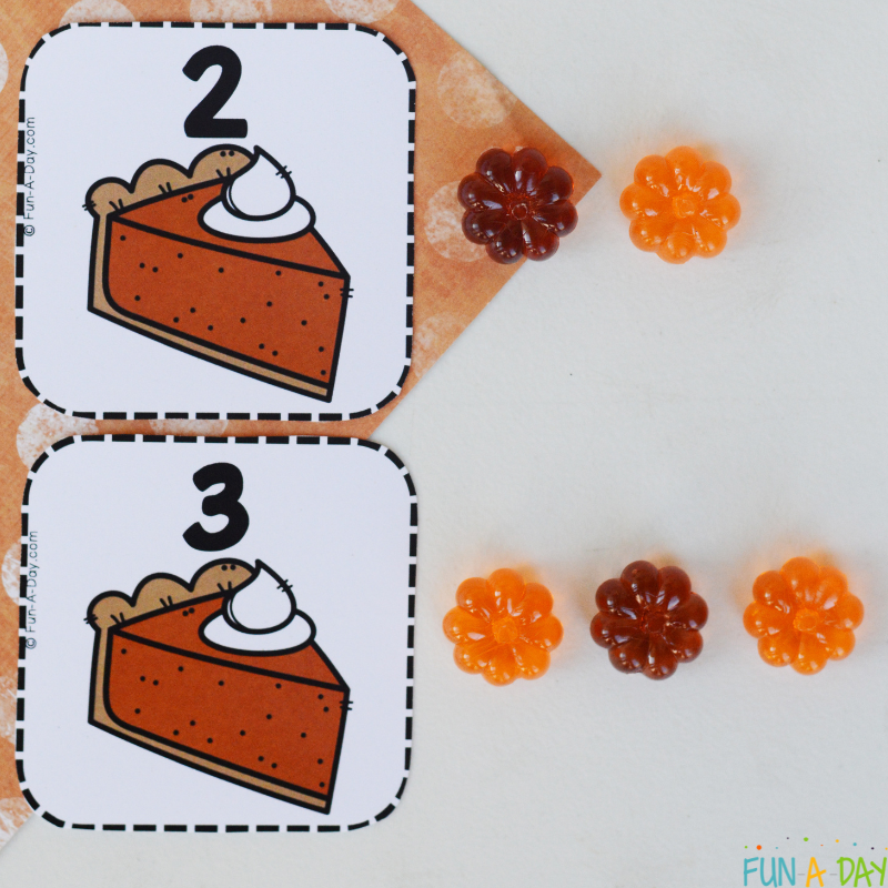 pumpkin pie number cards 2 and 3 with corresponding numbers of acrylic pumpkins