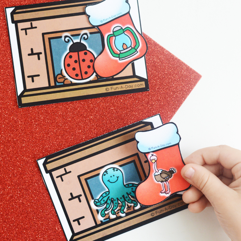 child matching christmas picture cards based on initial sounds