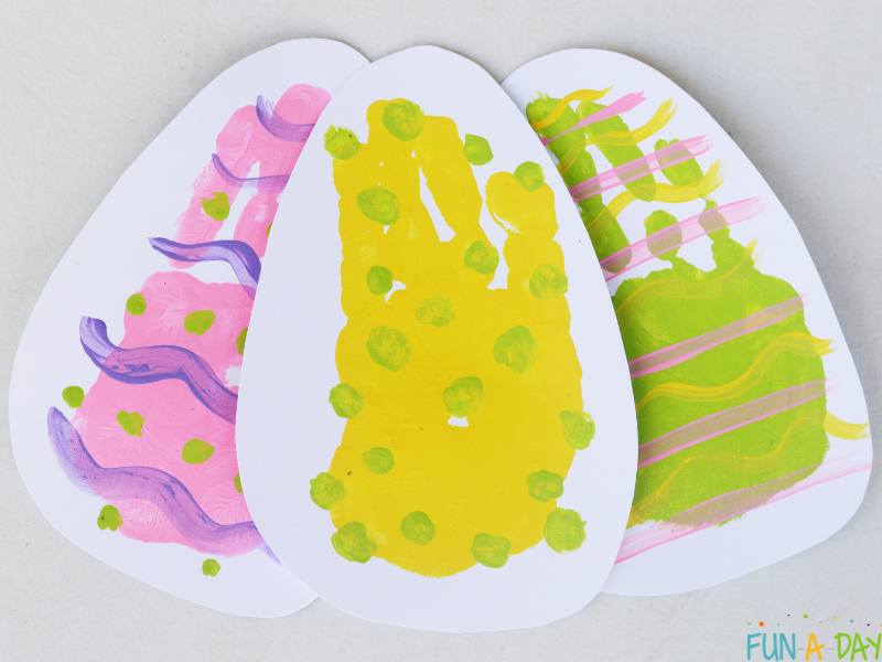 3 easter egg handprints made with preschoolers