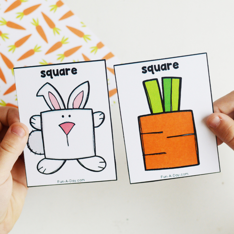 preschooler's hands matching square rabbit and carrot shape cards