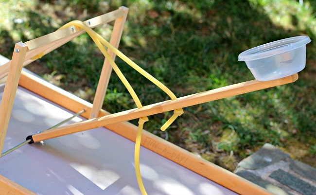 homemade catapult used for painting with preschoolers