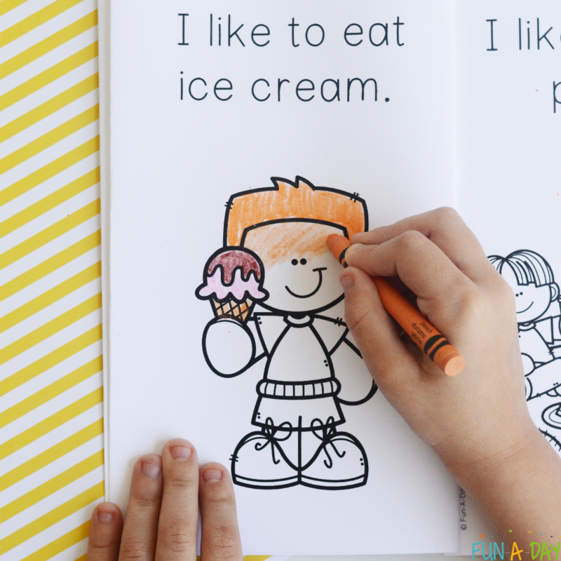 child coloring in a page of a printable summer book that reads I like to eat ice cream