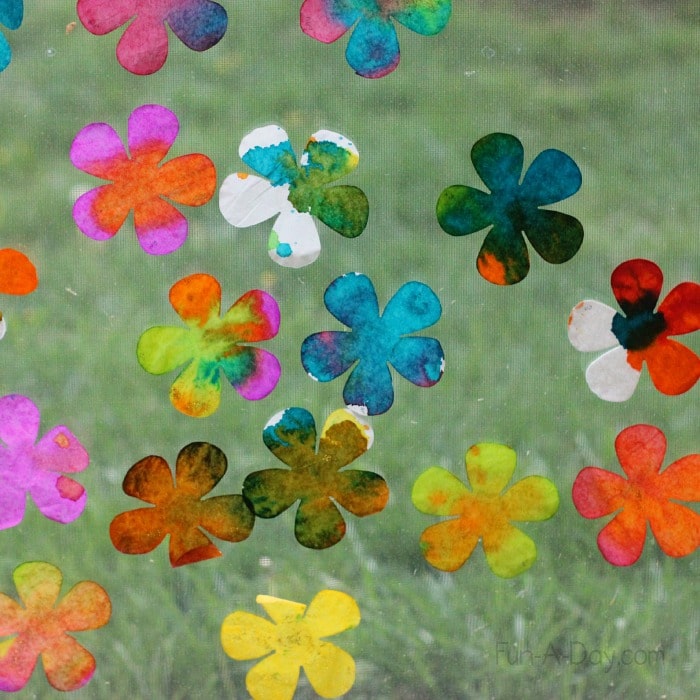 child-made coffee filter flowers in classroom window
