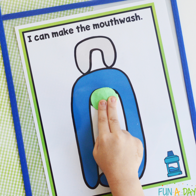 child using playdough to make mouthwash on one of the free printable dental playdough mats