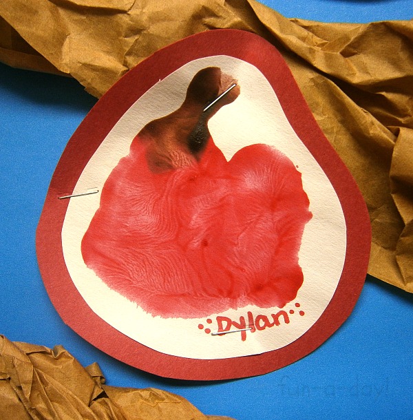 close up of child's apple hand print as part of a preschool apple bulletin board