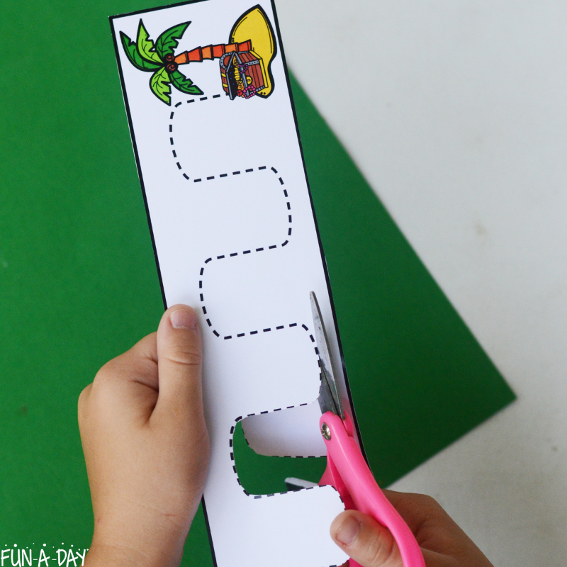 child using printable pirate cutting activity