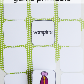 child matching picture of a vampire to the word vampire, with text that reads monster match game printable