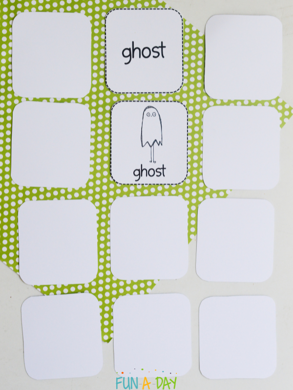 printable monster match game with 2 ghost cards turned over, the rest upside down