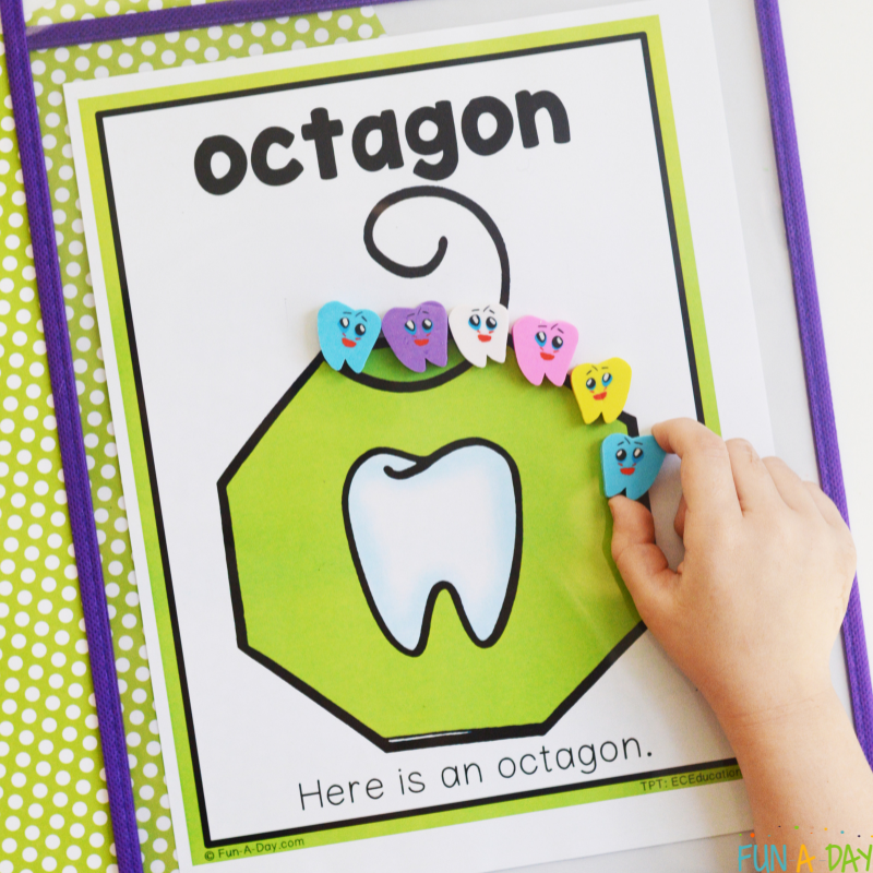 child using tooth erasers to trace over a dental shapes printable