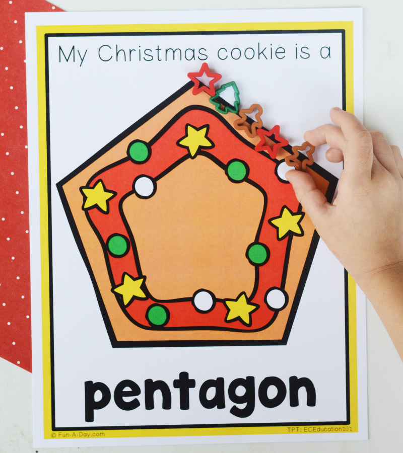 preschooler placing manipulatives around christmas-themed pentagon shape mat