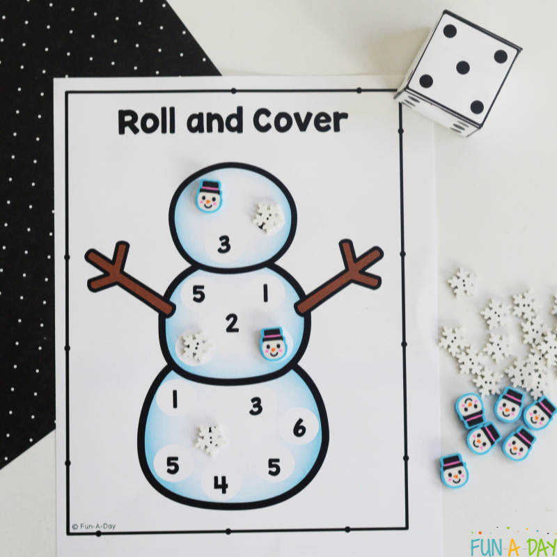 snowman roll and cover dice game with number cube and mini erasers