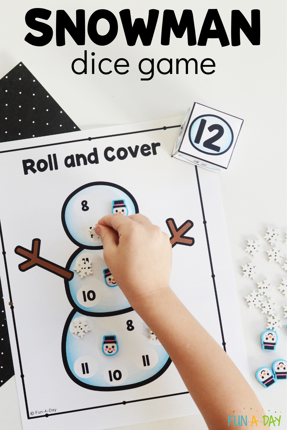 child placing a manipulative on the number 12 with text that reads snowman dice game