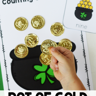 Child using gold coins on St. Patrick's Day printable with text that reads pot of gold number cards