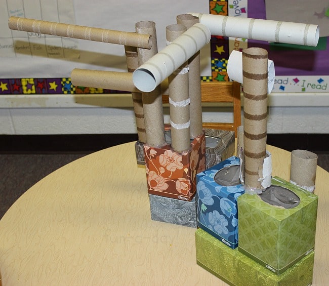 unpainted cardboard castle creations in preschool classroom